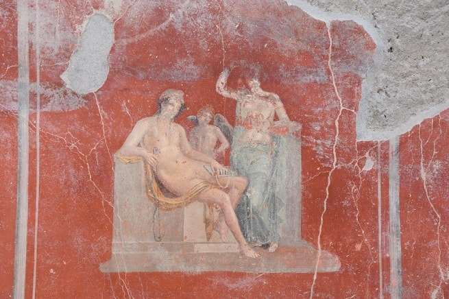 Affresco dalla Casa con Giardino: Venere con una figura maschile (forse Adone o Paride) e con Eros. Pompei, Regio V